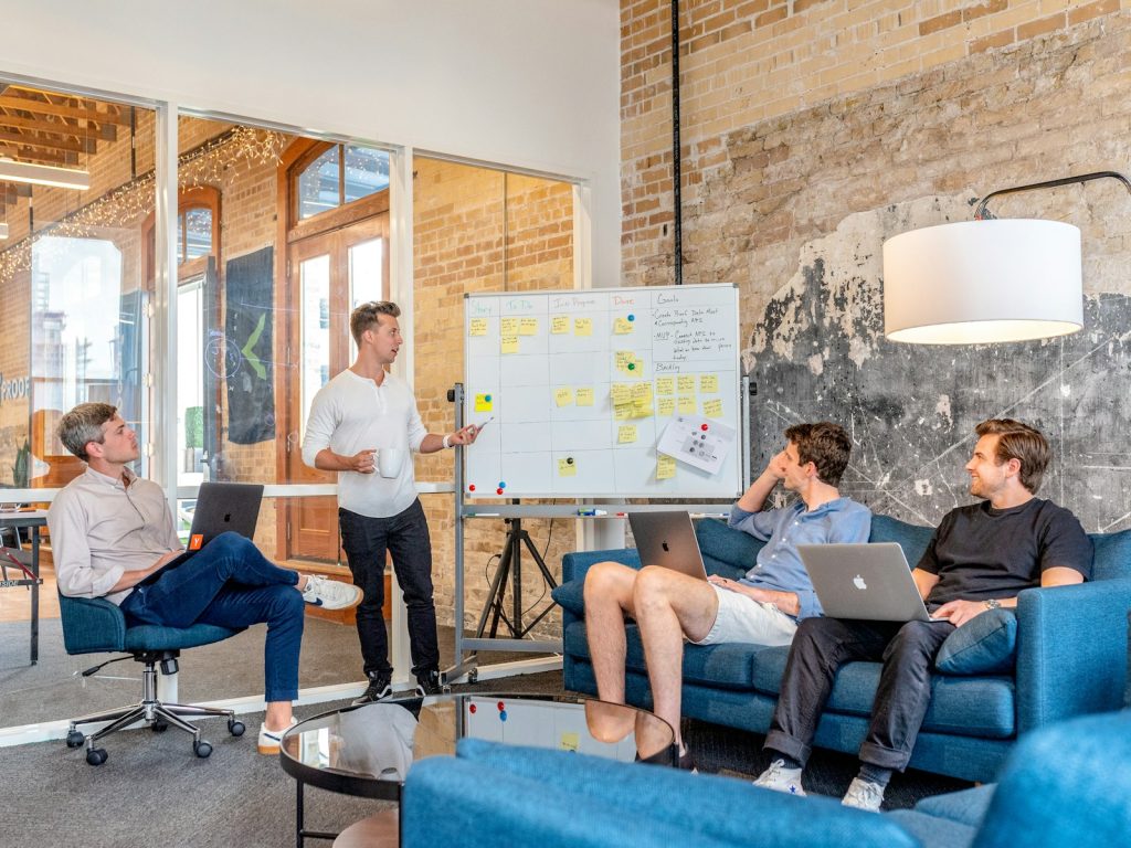 Marketing team planning around a whiteboard