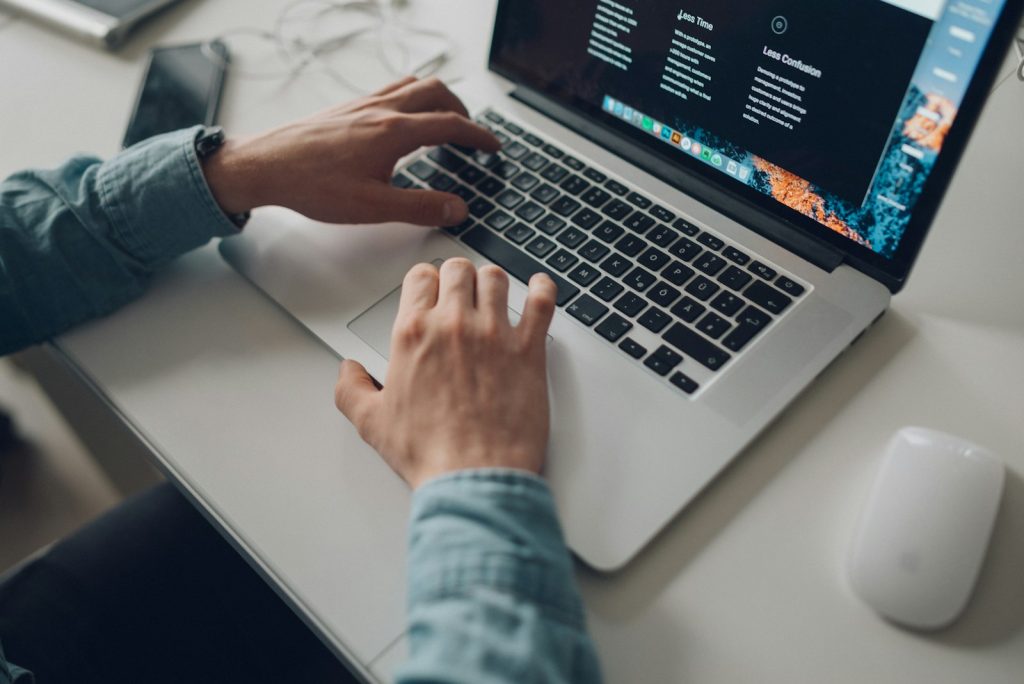 Freelancer browsing websites on a laptop