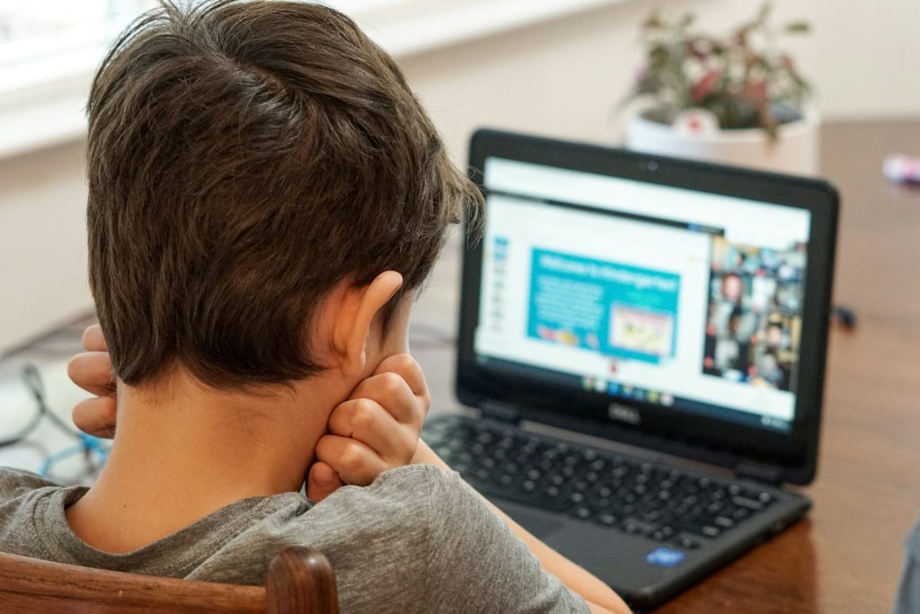 Student taking an online lesson on a laptop