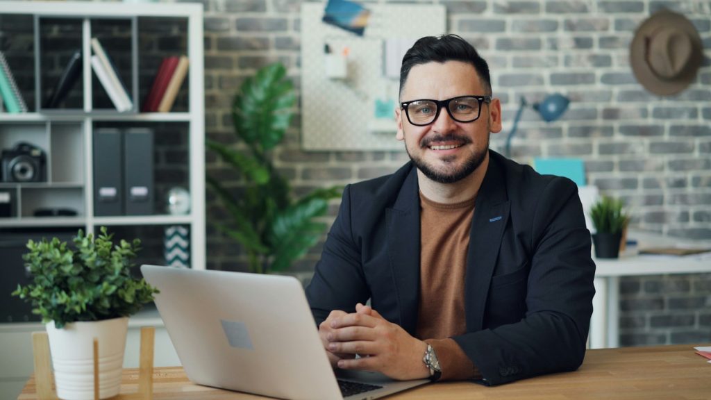 Professional man on a video interview at a laptop