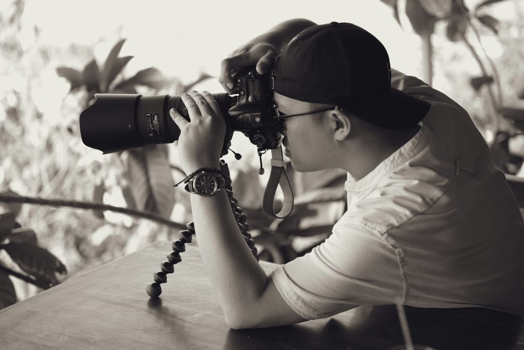 Photographer taking pictures with a camera
