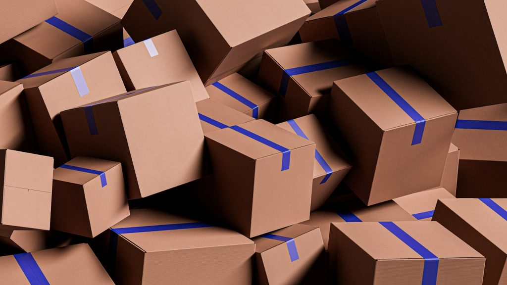 Pile of taped cardboard parcels ready to ship