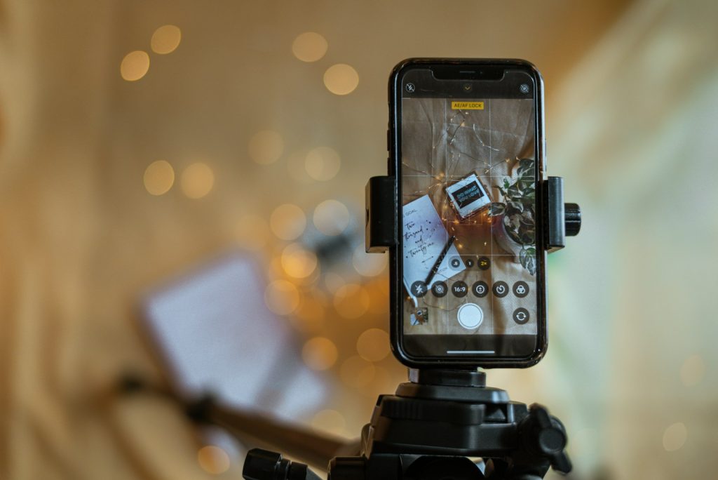 Smartphone on a tripod set up for product photos