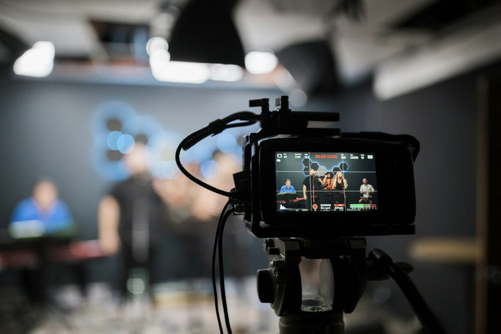 Video camera on a tripod recording content