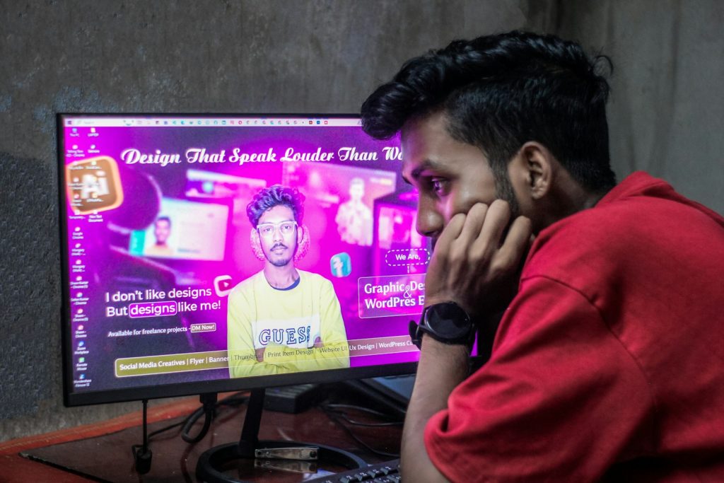 Creator studying a video thumbnail design on a large screen